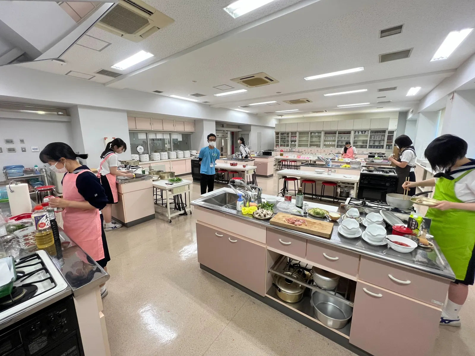 Students cooking with the harvest in the school's home-economics kitchen